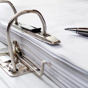 Pen on file folder with documents, storage of contracts. selecti Pen on file folder with documents, storage of contracts. selective focus.