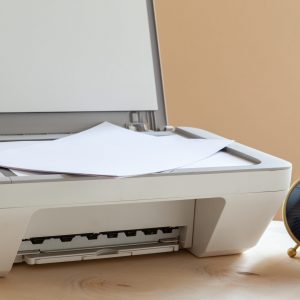 White scanner or printer machine on a table close up White scanner or printer machine on a table