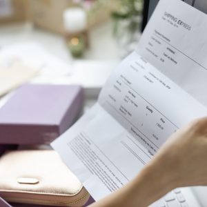 Woman holding bill payment Woman holding bill payment